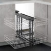 Magic Corner Reversible pull-out corner unit installed in a kitchen cabinet, showing full extension and chrome baskets.
