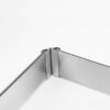Flexible corner connector joining kitchen plinth sections at a cabinet corner