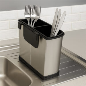 Stainless steel cutlery holder placed on a sink countertop with forks and knives drying