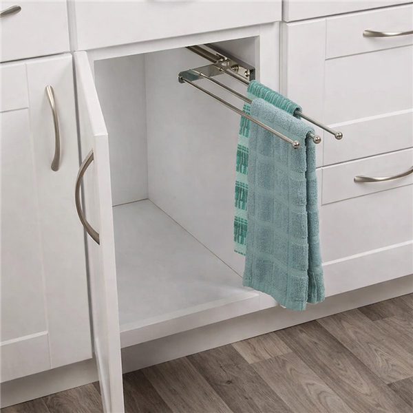 3 arm chrome pull out towel rack installed inside kitchen cabinet with towels hanging