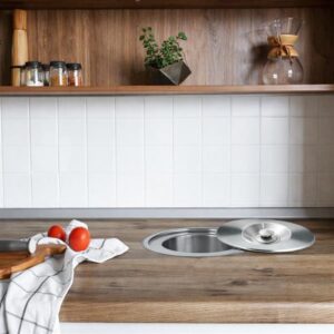 Stainless steel 12L counter bin with removable inner bucket installed in a kitchen countertop