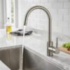 Stilino Capri stainless steel kitchen mixer tap with curved spout in modern kitchen sink