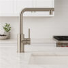 Stilino Verona stainless steel kitchen mixer tap in modern kitchen with a round end spout design