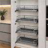 Four Nano Grace pull-out motion baskets installed in a tall kitchen cabinet
